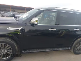 2019 Nissan Armada Platinum z VIN JN8AY2NF0K9351290, wystawiony jako IAAI lot #41234737 z przebiegiem 118 737 mil mil oraz . Historia ofert i sprzedaży dostępna na DreamBid. Obrazek 14.