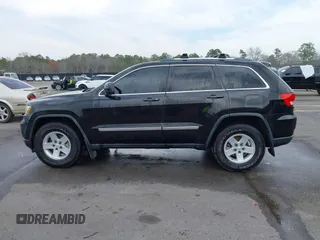 2012 Jeep Grand Cherokee Laredo with VIN 1C4RJEAG2CC259279, listed as a IAAI auction lot 41768024 with 185,161 mi miles. Bid and sale history available at carsss.com. Image 15.