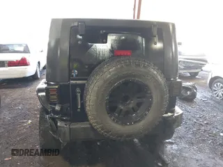 2008 Jeep Wrangler Unlimited Rubicon with VIN 1J8GA69108L562705, listed as a IAAI auction lot 41306923 with 150,002 mi miles and . Bid and sale history available at DreamBid. Image 16.