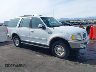 1997 Ford Expedition XLT z VIN 1FMFU18L4VLA40313, wystawiony jako IAAI lot #41258748 z przebiegiem 233 948 mil mil oraz . Historia ofert i sprzedaży dostępna na DreamBid. Obrazek 1.