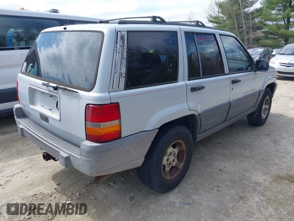1996 Jeep Grand Cherokee Laredo with VIN 1J4EX58S1TC122268, listed as a IAAI auction lot 42005236 with 288,466 mi miles. Bid and sale history available at carsss.com. Image 4.