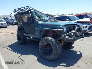2000 Jeep Wrangler Sahara z VIN 1J4FA59S0YP730853, wystawiony jako IAAI lot #42702526 z przebiegiem Nie podano mil oraz . Historia ofert i sprzedaży dostępna na DreamBid. Obrazek 1.