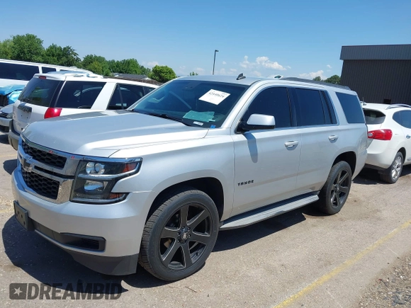 2015 Chevrolet Tahoe LT with VIN 1GNSCBKC9FR111001, listed as a IAAI auction lot 42440624 with 128,087 mi miles and . Bid and sale history available at DreamBid. Image 2.