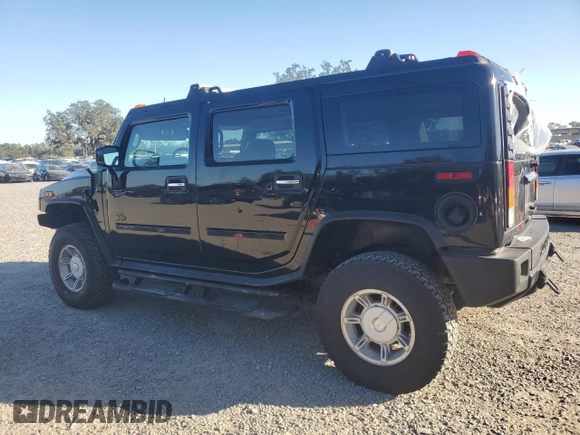 2003 Hummer H2 with VIN 5GRGN23UX3H136571, listed as a Copart auction lot 80823054 with 220,003 mi miles and Salvage Title. Bid and sale history available at carsss.com. Image 2.