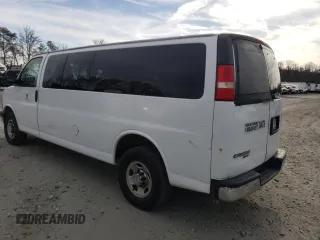 2014 Chevrolet Express Passenger LT with VIN 1GAZG1FG2E1202457, listed as a Copart auction lot 82704884 with 142,982 mi miles and Salvage title. Bid and sale history available at DreamBid. Image 2.