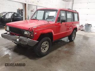 1991 Isuzu Trooper z VIN JACCH58R6M8905869, wystawiony jako IAAI lot #42394651 z przebiegiem 117 130 mil mil oraz . Historia ofert i sprzedaży dostępna na DreamBid. Obrazek 17.