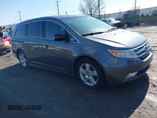 2013 Honda Odyssey Touring with VIN 5FNRL5H97DB018839, listed as a IAAI auction lot 41884016 with 171,650 mi miles and . Bid and sale history available at carsss.com. Image 1.