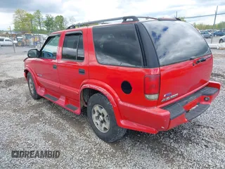 2004 Chevrolet Blazer LS z VIN 1GNDT13X64K127182, wystawiony jako IAAI lot #42188177 z przebiegiem 135 946 mil mil oraz . Historia ofert i sprzedaży dostępna na DreamBid. Obrazek 3.