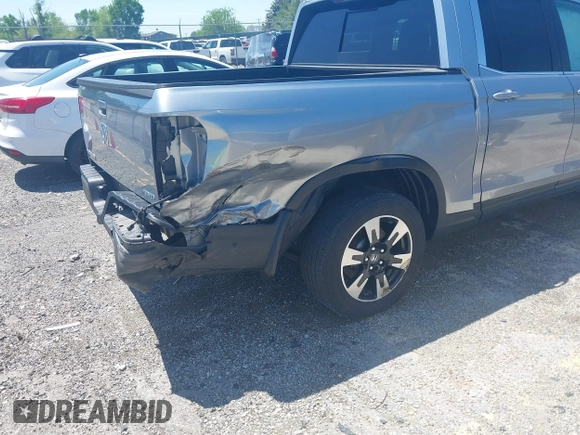 2020 Honda Ridgeline RTL with VIN 5FPYK3F5XLB019296, listed as a IAAI auction lot 42204290 with 48,197 mi miles and . Bid and sale history available at DreamBid. Image 6.