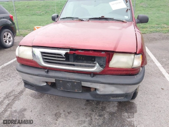1999 Mazda B-Series 2WD Truck SX with VIN 4F4YR12C5XTM40608, listed as a IAAI auction lot 41928067 with 329,510 mi miles. Bid and sale history available at carsss.com. Image 6.