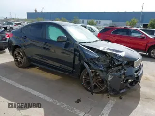 2015 BMW X4 xDrive35i with VIN 5UXXW5C50F0E87728, listed as a IAAI auction lot 41819628 with 136,042 mi miles. Bid and sale history available at carsss.com. Image 1.