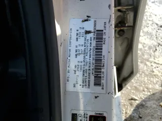 2011 Mazda 3 i Touring with VIN JM1BL1VF1B1357056, listed as a Copart auction lot 87734455 with 142,103 mi miles and Salvage Title. Bid and sale history available at carsss.com. Image 12.