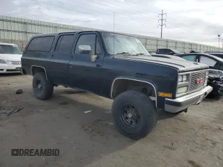 1989 GMC Suburban z VIN 1GKGV26K0KF517730, wystawiony jako Copart lot #41437715 z przebiegiem 21 423 mil mil oraz Szkody całkowita. Historia ofert i sprzedaży dostępna na DreamBid. Obrazek 4.