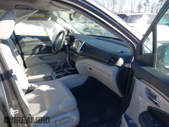 2017 Honda Pilot EX-L with VIN 5FNYF6H59HB101815, listed as a IAAI auction lot 41704661 with 130,479 mi miles and . Bid and sale history available at DreamBid. Image 5.
