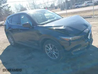 2019 Mazda CX-5 Grand Touring with VIN JM3KFBDM2K0603297, listed as a IAAI auction lot 41668241 with 54,583 mi miles. Bid and sale history available at carsss.com. Image 1.
