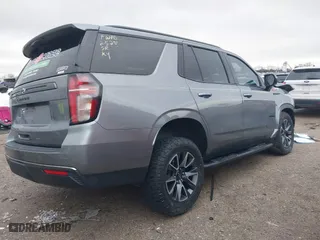 2022 Chevrolet Tahoe Z71 with VIN 1GNSKPKD4NR117277, listed as a IAAI auction lot 41547290 with 76,859 mi miles. Bid and sale history available at carsss.com. Image 4.