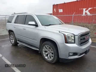 2015 GMC Yukon SLT with VIN 1GKS2BKCXFR131919, listed as a IAAI auction lot 41664827 with 149,398 mi miles. Bid and sale history available at carsss.com. Image 1.