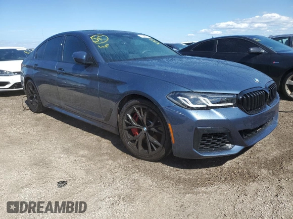 2023 BMW 5 Series M550i xDrive with VIN WBA13BK08PCN51125, listed as a Copart auction lot 76781294 with 8,855 mi miles and Non repairable. Bid and sale history available at DreamBid. Image 4.