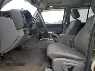 2007 Jeep Commander Sport z VIN 1J8HG48P97C622153, wystawiony jako Copart lot #50291165 z przebiegiem 113 516 mil mil oraz Szkoda całkowita • Salvage title. Historia ofert i sprzedaży dostępna na DreamBid. Obrazek 7.