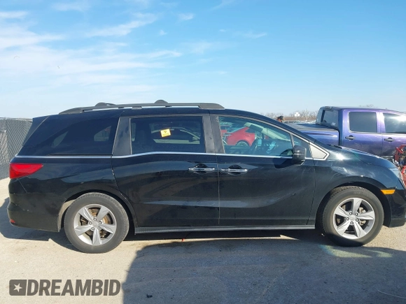 2018 Honda Odyssey EX-L z VIN 5FNRL6H74JB031306, wystawiony jako IAAI lot #41603478 z przebiegiem Nie podano mil oraz . Historia ofert i sprzedaży dostępna na DreamBid. Obrazek 13.
