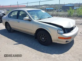 1999 Nissan Maxima GXE z VIN JN1CA21D3XT810886, wystawiony jako IAAI lot #42080030 z przebiegiem 91 980 mil mil oraz . Historia ofert i sprzedaży dostępna na DreamBid. Obrazek 1.