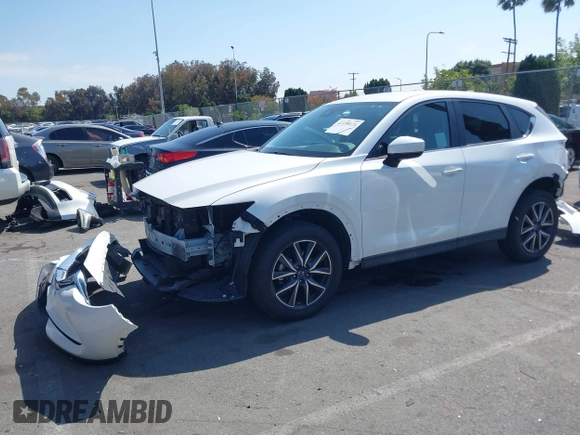 2018 Mazda CX-5 Touring with VIN JM3KFACM0J0416716, listed as a IAAI auction lot 42150121 with 61,332 mi miles and . Bid and sale history available at carsss.com. Image 18.