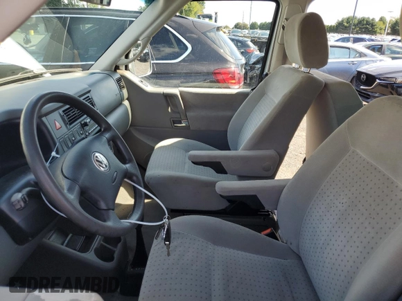 2003 Volkswagen EuroVan MV с VIN WV2MB47023H044047, выставлен на аукционе Copart как лот 71014624 с пробегом 189 485 миль миль и Чистый • Clean title. История ставок и продаж доступна на DreamBid. Изображение 7.