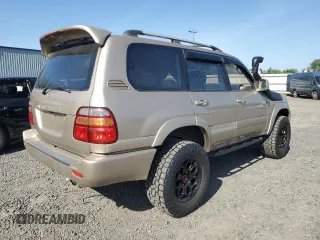 1999 Toyota Land Cruiser z VIN JT3HT05J0X0039052, wystawiony jako Copart lot #54229355 z przebiegiem 228 216 mil mil oraz Czysty tytuł • Clean title. Historia ofert i sprzedaży dostępna na DreamBid. Obrazek 3.
