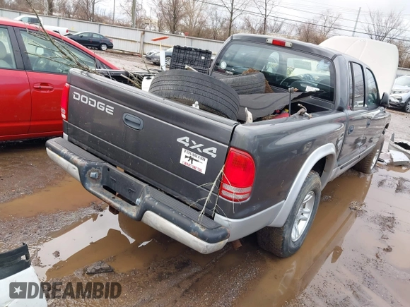 2002 Dodge Dakota SLT z VIN 1B7HG48N32S634478, wystawiony jako IAAI lot #41485500 z przebiegiem 166 082 mil mil oraz . Historia ofert i sprzedaży dostępna na DreamBid. Obrazek 4.