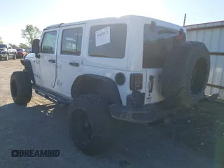 2016 Jeep Wrangler Unlimited Sahara with VIN 1C4BJWEG5GL243004, listed as a IAAI auction lot 40438321 with 121,360 mi miles and . Bid and sale history available at DreamBid. Image 3.
