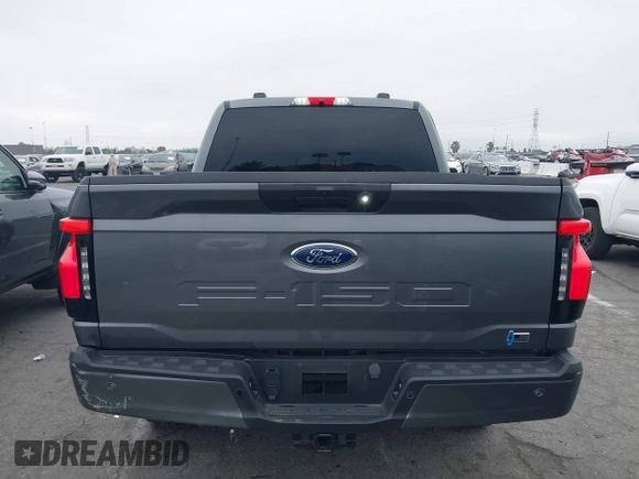 2023 Ford F-150 Lightning Pro with VIN 1FTVW1EL8PWG48559, listed as a IAAI auction lot 42033123 with 8,845 mi miles and . Bid and sale history available at DreamBid. Image 16.