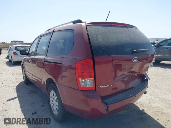 2012 Kia Sedona LX with VIN KNDMG4C70C6463190, listed as a IAAI auction lot 41781336 with 179,860 mi miles. Bid and sale history available at carsss.com. Image 3.