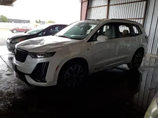 2021 Cadillac XT6 AWD Sport z VIN 1GYKPHRSXMZ195978, wystawiony jako Copart lot #80886314 z przebiegiem Nie podano mil oraz Szkody całkowita. Historia ofert i sprzedaży dostępna na DreamBid. Obrazek 1.