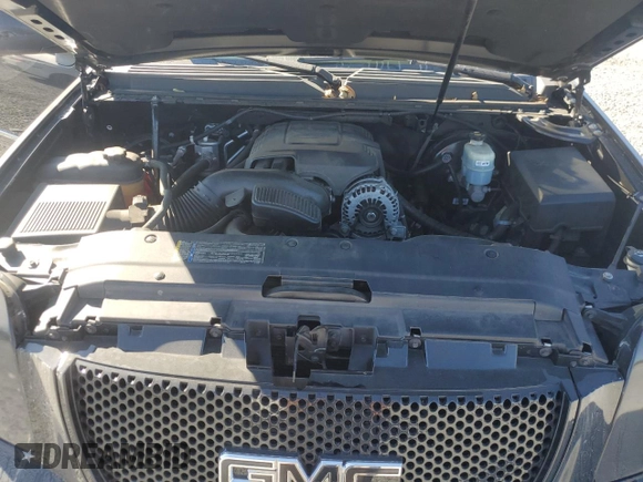2011 GMC Yukon Denali with VIN 1GKS1EEFXBR121055, listed as a Copart auction lot 77194354 with 98,806 mi miles and Salvage Title. Bid and sale history available at carsss.com. Image 14.