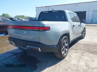 2022 Rivian R1T Adventure z VIN 7FCTGAAA2NN006053, wystawiony jako IAAI lot #41974199 z przebiegiem 286 mil mil oraz . Historia ofert i sprzedaży dostępna na DreamBid. Obrazek 4.