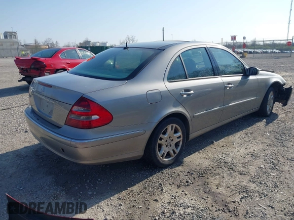 2003 Mercedes-Benz E-Class 3.2L with VIN WDBUF65J93X099223, listed as a IAAI auction lot 42033473 with 230,758 mi miles. Bid and sale history available at carsss.com. Image 4.