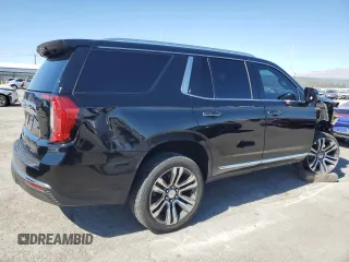 2021 GMC Yukon SLT with VIN 1GKS1BKDXMR119990, listed as a Copart auction lot 74733094 with 73,597 mi miles and Salvage Title. Bid and sale history available at carsss.com. Image 3.