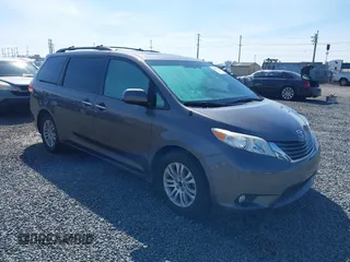 2014 Toyota Sienna XLE with VIN 5TDYK3DC5ES451965, listed as a IAAI auction lot 41879334 with 145,114 mi miles and . Bid and sale history available at DreamBid. Image 1.