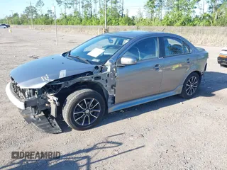 2015 Mitsubishi Lancer SE with VIN JA32V2FWXFU023626, listed as a IAAI auction lot 42012381 with 143,981 mi miles. Bid and sale history available at carsss.com. Image 17.