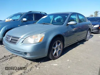 2002 Nissan Altima SE with VIN 1N4BL11E22C121586, listed as a IAAI auction lot 41409205 with 213,720 mi miles. Bid and sale history available at carsss.com. Image 2.