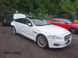 2015 Jaguar XJ Portfolio with VIN SAJWJ2GD2F8V90256, listed as a IAAI auction lot 42311335 with 123,299 mi miles and . Bid and sale history available at DreamBid. Image 1.
