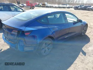 2023 Tesla Model 3 with VIN 5YJ3E1EA2PF690335, listed as a IAAI auction lot 41732701 with 22,238 mi miles and . Bid and sale history available at DreamBid. Image 4.