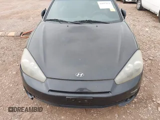 2007 Hyundai Tiburon GT z VIN KMHHN66F37U250320, wystawiony jako IAAI lot #42047654 z przebiegiem 231 899 mil mil oraz . Historia ofert i sprzedaży dostępna na DreamBid. Obrazek 6.