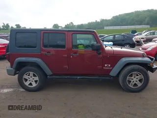 2008 Jeep Wrangler Unlimited X with VIN 1J4GA39108L606685, listed as a IAAI auction lot 41965538 with 288,946 mi miles. Bid and sale history available at carsss.com. Image 13.