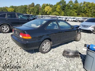 1997 Honda Civic DX with VIN 1HGEJ6228VL123265, listed as a Copart auction lot 74078684 with 49,904 mi miles and Salvage Title. Bid and sale history available at carsss.com. Image 3.