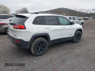 2016 Jeep Cherokee Trailhawk with VIN 1C4PJMBS7GW241076, listed as a IAAI auction lot 42020124 with 151,742 mi miles and . Bid and sale history available at DreamBid. Image 4.