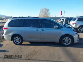 2014 Toyota Sienna XLE z VIN 5TDYK3DC9ES508300, wystawiony jako IAAI lot #41867307 z przebiegiem 93 798 mil mil oraz . Historia ofert i sprzedaży dostępna na DreamBid. Obrazek 13.