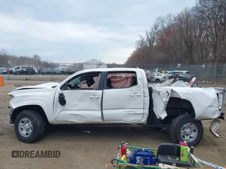 2022 Toyota Tacoma SR with VIN 3TYAX5GN3NT062077, listed as a IAAI auction lot 41886531 with 58,687 mi miles and . Bid and sale history available at DreamBid. Image 14.