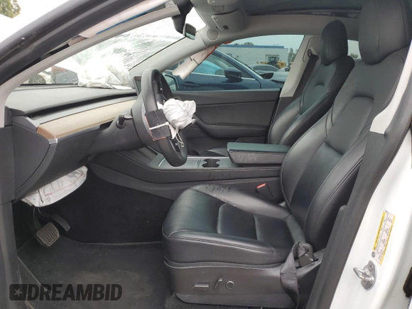 2021 Tesla Model Y Long Range with VIN 5YJYGDEE3MF214823, listed as a Copart auction lot 50738045 with 63,227 mi miles and Salvage Title. Bid and sale history available at DreamBid. Image 7.