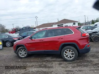 2014 Jeep Cherokee Latitude with VIN 1C4PJMCS0EW261021, listed as a IAAI auction lot 41986701 with 114,633 mi miles. Bid and sale history available at carsss.com. Image 11.